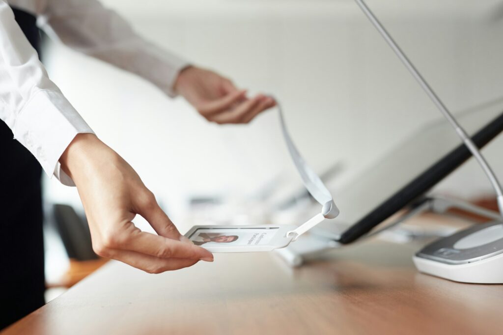 Woman Placing ID Card on Table